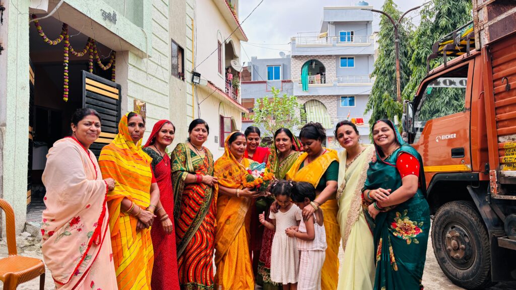 pexels photo 33808945 33808945 Group of women in colorful sarees celebrating outdoors in an Indian neighborhood with children. Cultural festivity vibe.